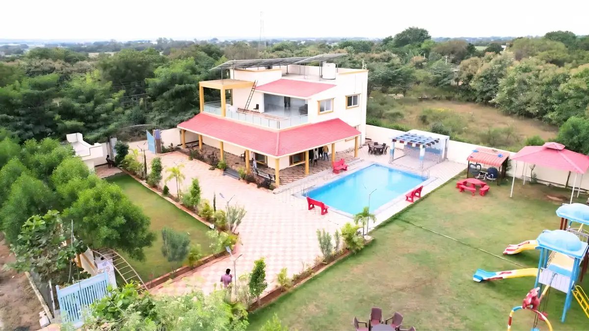 Eco-friendly residential estate with swimming pool, gardens, paved pathways, and integrated landscape architecture.