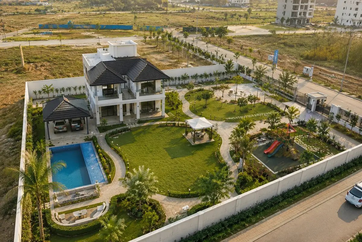 Premium farmhouse development with landscaped lawns, gardens, swimming pool, and integrated green living spaces.